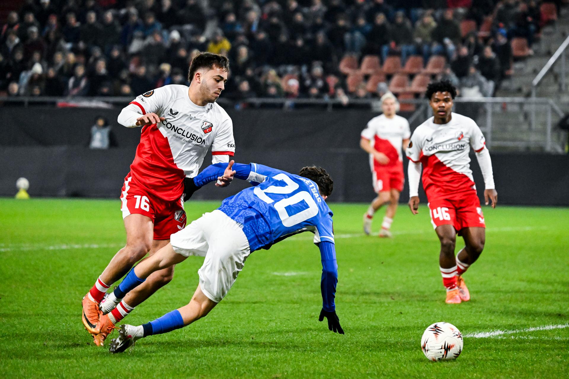 Genk's Konstantinos Kos Karetsas is taken down in the penalty box by and Utrecht's Souffian El Karouani during a soccer game between Dutch soccer club FC Utrecht and Belgian KRC Genk, on Thursday 22 January 2026 in Utrecht, Netherlands, the seventh game (out of 8) in the league phase of the UEFA Europa League competition. BELGA PHOTO TOM GOYVAERTS