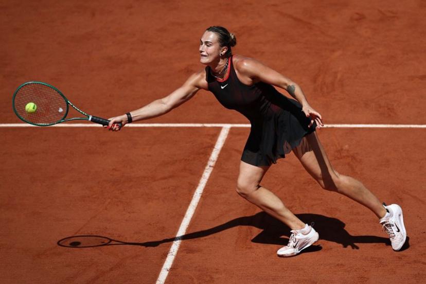 Aryna Sabalenka plays a forehand return to Australia's Daria Kasatkina during their women's singles match on day 7 of the French Open tennis tournament on Court Suzanne-Lenglen at the Roland-Garros Complex in Paris on May 30, 2026.  Anne-Christine POUJOULAT / AFP