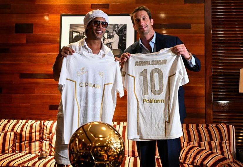 Brazilian football legend Ronaldinho poses with Ravenna FC president Ignazio Cipriani during an event marking his presentation as ambassador and strategic partner of the Italian club in Miami, Florida, on June 23, 2026.  CHANDAN KHANNA / AFP