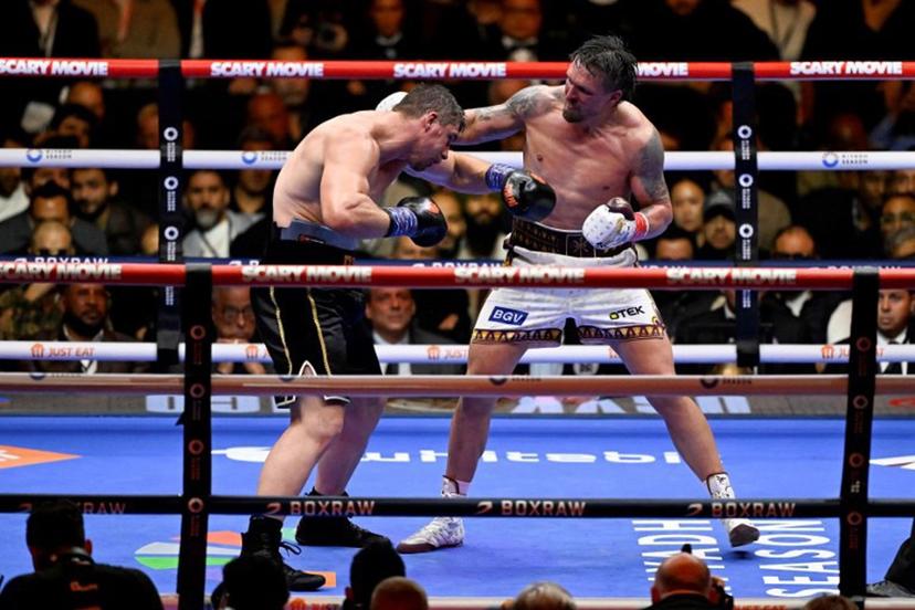 Ukraine's Oleksandr Usyk (R) fights Netherlands' Rico Verhoeven (L) during their WBC World Heavyweight Championship 'Glory in Giza' boxing match at the Pyramids of Giza on May 23, 2026. Heavyweight boxing king Oleksandr Usyk retained his titles after a dramatic and controversial stoppage victory over kick-boxer Rico Verhoeven with a second left of the 11th round in Egypt on May 23. Khaled DESOUKI / AFP