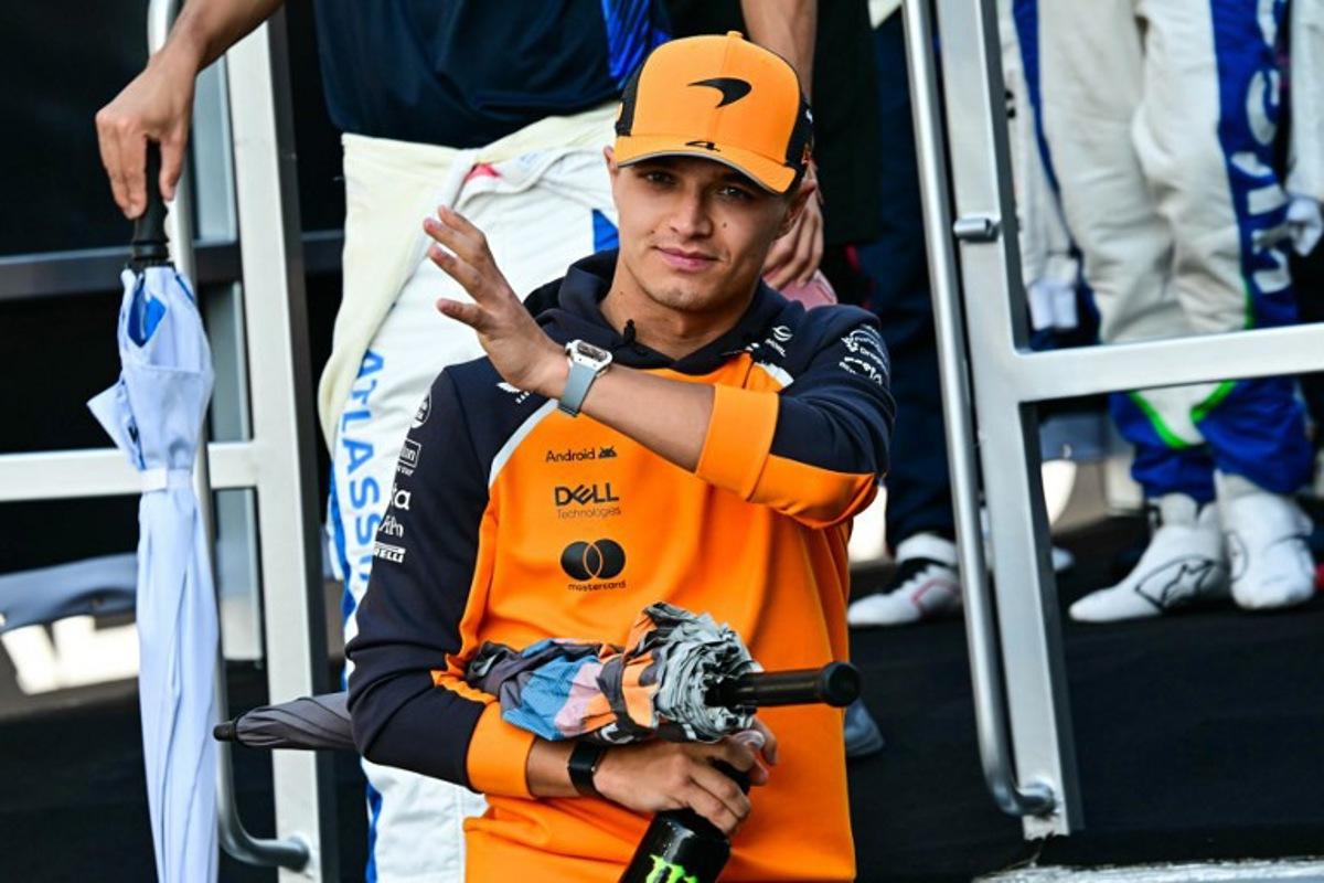 McLaren's British driver Lando Norris arrives to take part in the drivers' parade ahead of the Abu Dhabi Formula One Grand Prix at the Yas Marina Circuit in Abu Dhabi on December 7, 2025.  Giuseppe CACACE / AFP