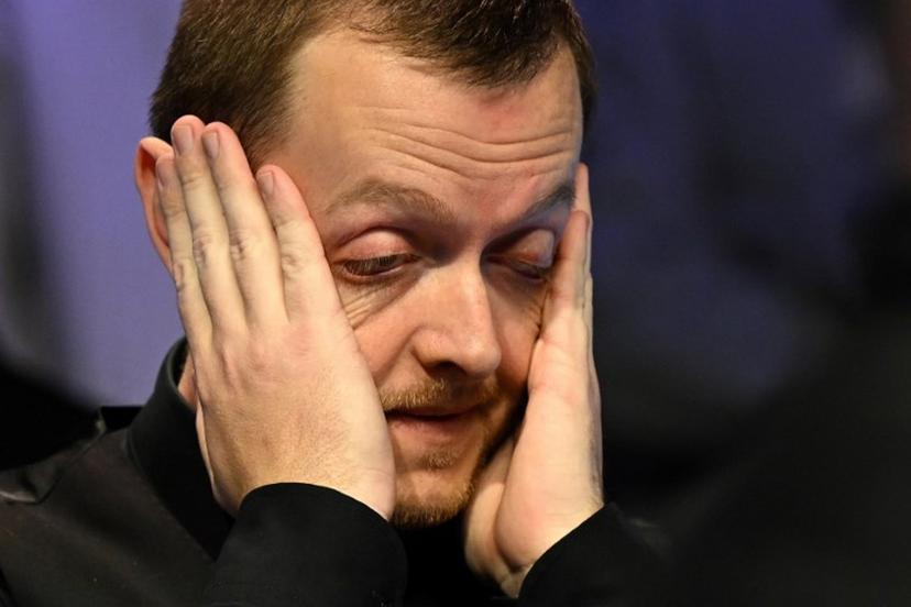 Northern Ireland's Mark Allen reacts after winning the snooker final of the 2022 Cazoo UK Championship at the York Barbican in York, on November 20, 2022. Northern Ireland's Mark Allen beat China's Ding Junhui 10-7 in the final. Oli SCARFF / AFP