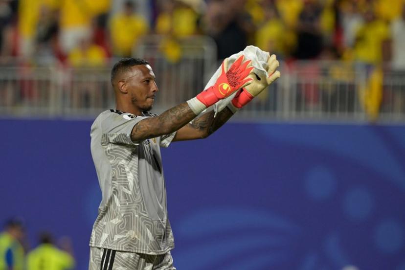 Curacao's goalkeeper #01 Eloy Room celebrates at the end of the 2026 World Cup Group E football match between Ecuador and Curacao at the Kansas City Stadium in Kansas City on June 20, 2026.   JUAN MABROMATA / AFP