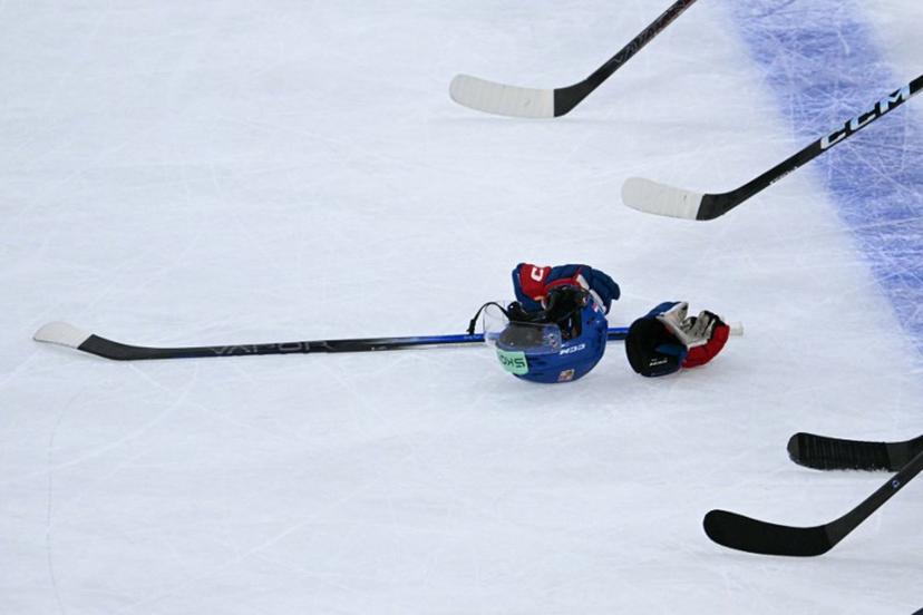 This photograph shows an Ice Hockey helmet, gloves and an Ice Hockey stick at the end of the IIHF Ice Hockey Men's World Championship quarter-final match between Finland and Czech Republic at the Swiss Life Arena in Zurich, Switzerland on May 28, 2026.  SEBASTIEN BOZON / AFP