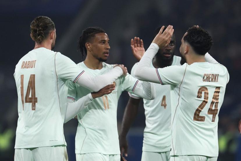 France's forward #11 Michael Olise (2L) celebrates scoring his team's third goal with France's midfielder #14 Adrien Rabiot (L) and France's defender #04 Dayot Upamecano and France's forward #24 Rayan Cherki (R) during the international friendly football match between France and North Ireland at the Decathlon Arena - Pierre Mauroy stadium in Villeneuve-d'Ascq, northern France on June 8, 2026, ahead of the 2026 FIFA World Cup football tournament.  FRANCK FIFE / AFP