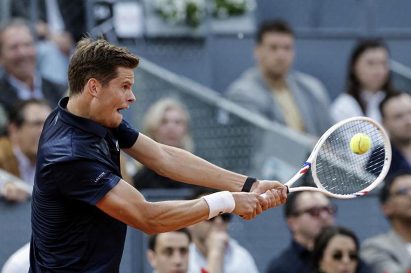 Belgium's Alexander Blockx returns the ball to Germany's Alexander Zverev during their 2026 ATP Tour Madrid Open tennis tournament semi-final singles match at the Caja Magica in Madrid, on May 1, 2026.  OSCAR DEL POZO / AFP
