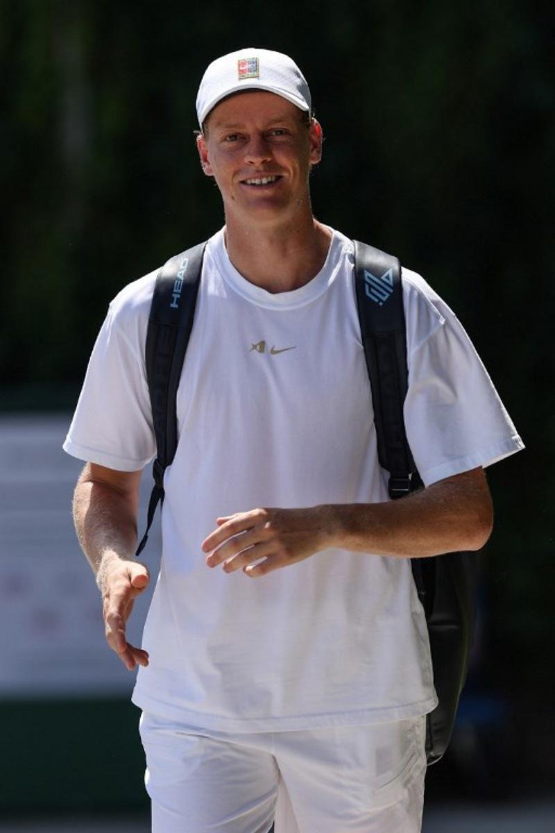 Italy's Jannik Sinner arrives at the practice courts at The All England Lawn Tennis and Croquet Club in Wimbledon, southwest London, on June 25, 2026, ahead of the 2026 Wimbledon Championships.  Adrian Dennis / AFP