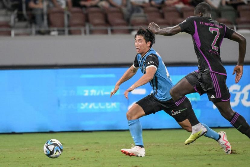 Kawasaki Frontale's Shin Yamada (L) fights for the ball with Bayern Munich's Dayot Upamecano during the football friendly match between Japan's Kawasaki Frontale and Germany's Bayern Munich at the National Stadium in Tokyo on July 29, 2023.  Richard A. Brooks / AFP