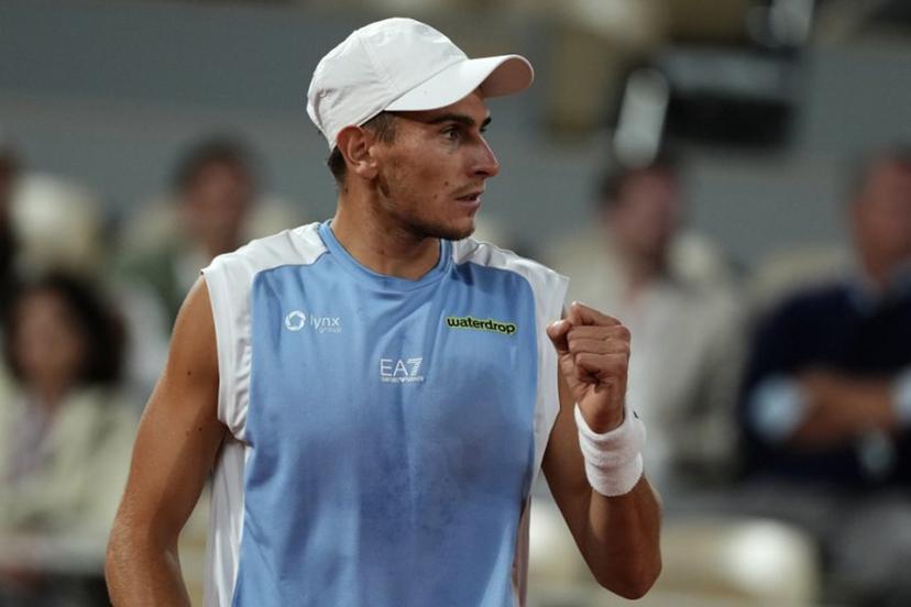 Italy's Matteo Arnaldi reacts to a point against Italy's Matteo Berrettini during their men's quarter final singles match on day 11 of the French Open tennis tournament on Court Philippe-Chatrier at the Roland-Garros Complex in Paris on June 3, 2026.  Dimitar DILKOFF / AFP