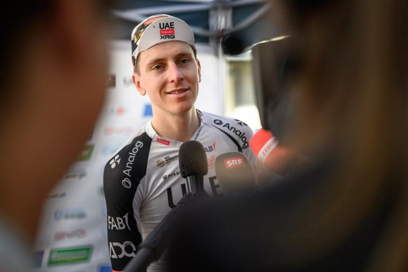 UAE Team Emirates-XRG's Slovenian rider Tadej Pogacar answers questions from jounalists after winning the fourth stage, a 23,7 km time trial from Aarburg to Aarburg, at the Men's Tour of Switzerland (Tour de Suisse) cycling race in Aarburg, Switzerland, on June 20, 2026.  Fabrice COFFRINI / AFP