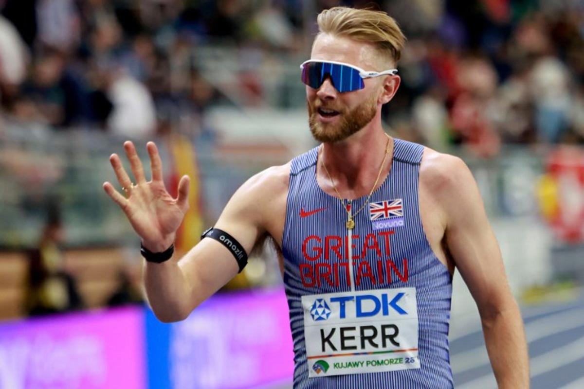 Britain's Josh Kerr celebrates winning the men's 3000m final during the World Athletics Indoor Championships Kujawy Pomorze 2026 in Torun, Poland on March 21, 2026.  Wojtek RADWANSKI / AFP