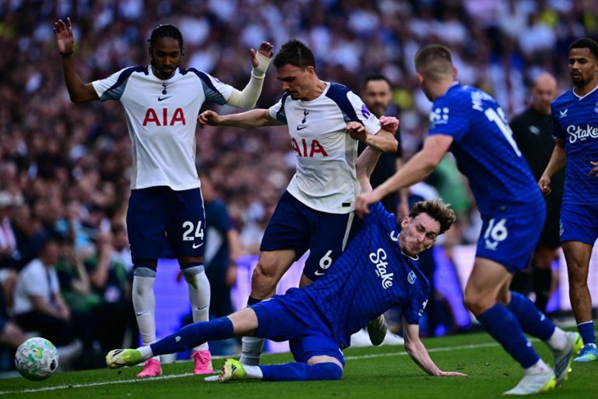 Everton's English midfielder #37 James Garner (2R) vies with Tottenham Hotspur's Portugese midfielder #06 Joao Palhinha (2L) during the English Premier League football match between Tottenham Hotspur and Everton at the Tottenham Hotspur Stadium in London, on May 24, 2026.  Ben STANSALL / AFP