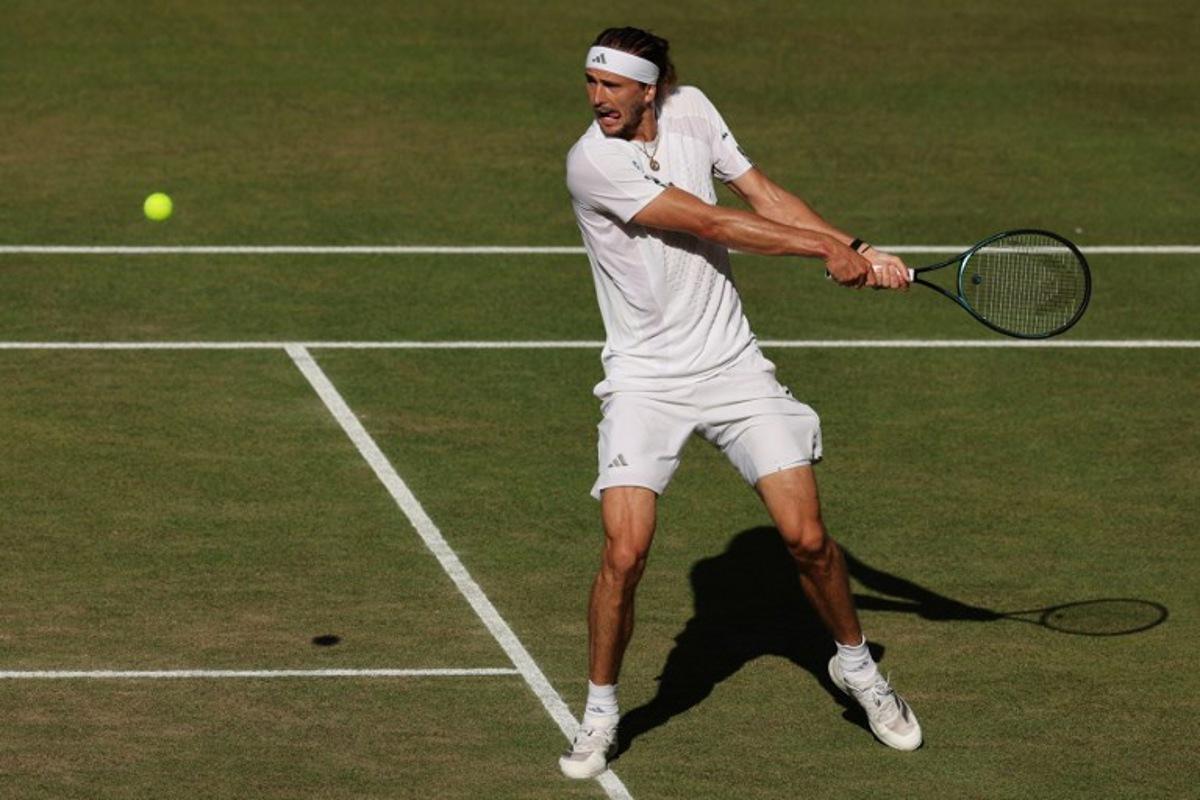 Germany's Alexander Zverev returns to Italy's Jannik Sinner during their men's singles final tennis match on the fourteenth day of the 2026 Wimbledon Championships at The All England Lawn Tennis and Croquet Club in Wimbledon, southwest London, on July 12, 2026.  Adrian Dennis / AFP