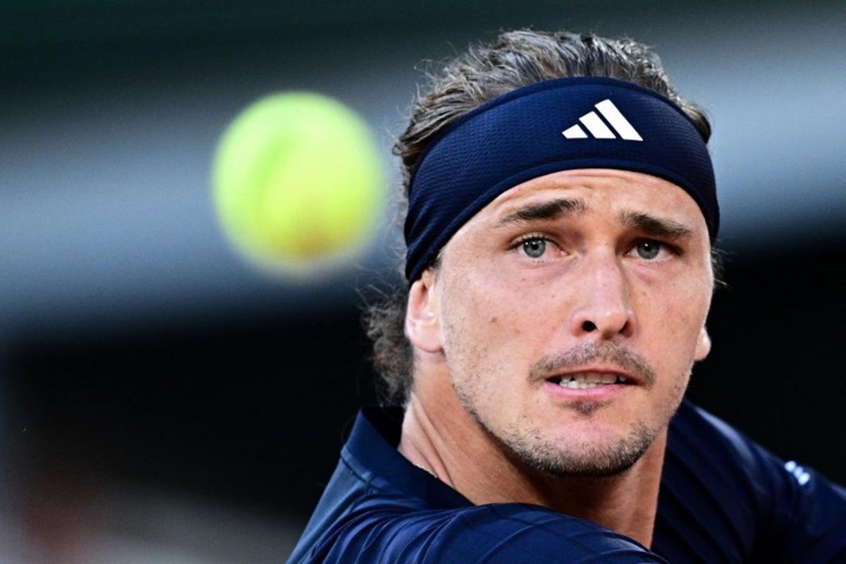 Germany's Alexander Zverev eyes the ball as he plays against Czech Republic's Tomas Machac during their men's singles match on day 4 of the French Open tennis tournament on Court Philippe-Chatrier at the Roland-Garros Complex in Paris on May 27, 2026.  JULIEN DE ROSA / AFP