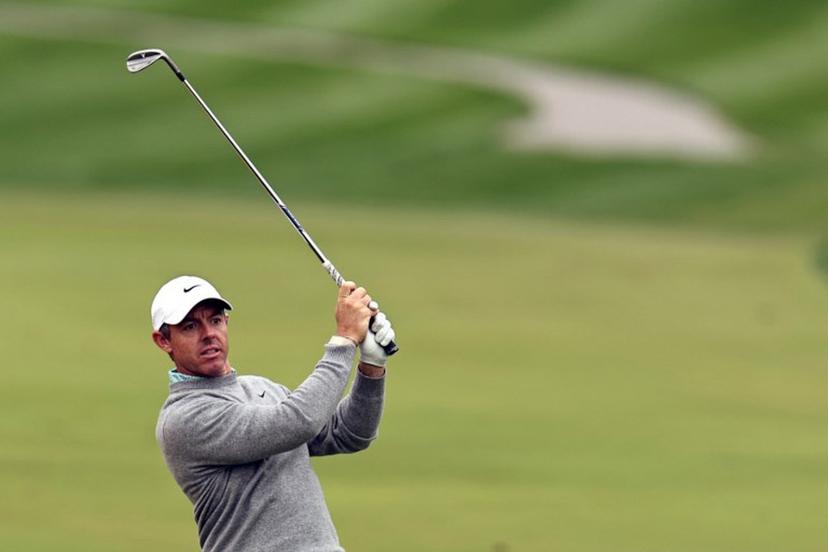 Rory McIlroy of Northern Ireland plays a shot on the 1st hole during the Hero Dubai Desert Classic golf tournament at the Emirates Golf Club in Dubai on January 25, 2026.  Fadel SENNA / AFP