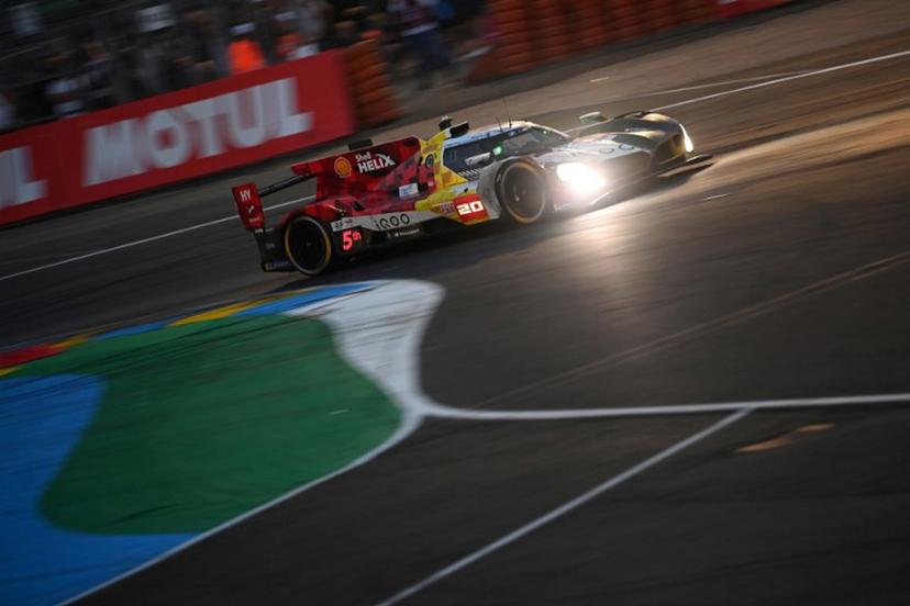 BMW M Team WRT's German driver #20 Rene Rast steers his hypercar during the 2025 Le Mans 24 hour endurance race, at the Le Mans circuit, in north-western France on June 14, 2025.  JEAN-FRANCOIS MONIER / AFP