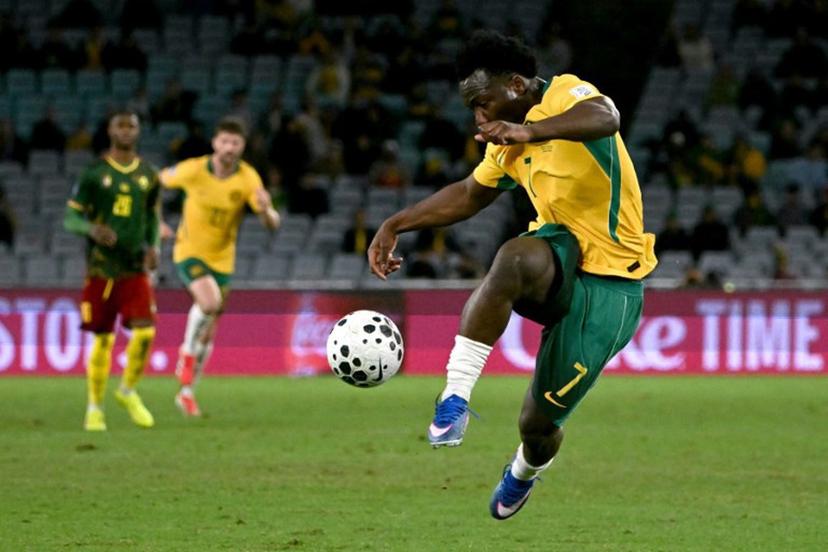 Australia's Nestory Irankunda kicks the ball during the international friendly football match between Australia and Cameroon at Stadium Australia in Sydney on March 27, 2026.  SAEED KHAN / AFP