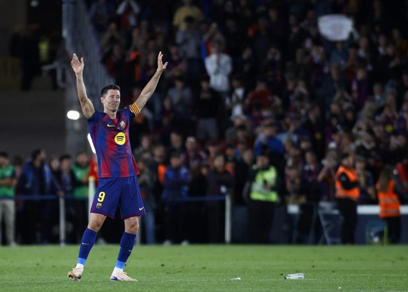Barcelona's Polish forward #09 Robert Lewandowski waves to fans at the end of the Spanish league football match between FC Barcelona and Real Betis at the Camp Nou Stadium in Barcelona on May 17, 2026. Barcelona striker Robert Lewandowski said yesterday he is leaving the club this summer at the end of his contract. The veteran Polish forward, 37, scored 119 goals for Barcelona in 191 games across all competitions since joining from Bayern Munich in 2022. JAIME REINA / AFP