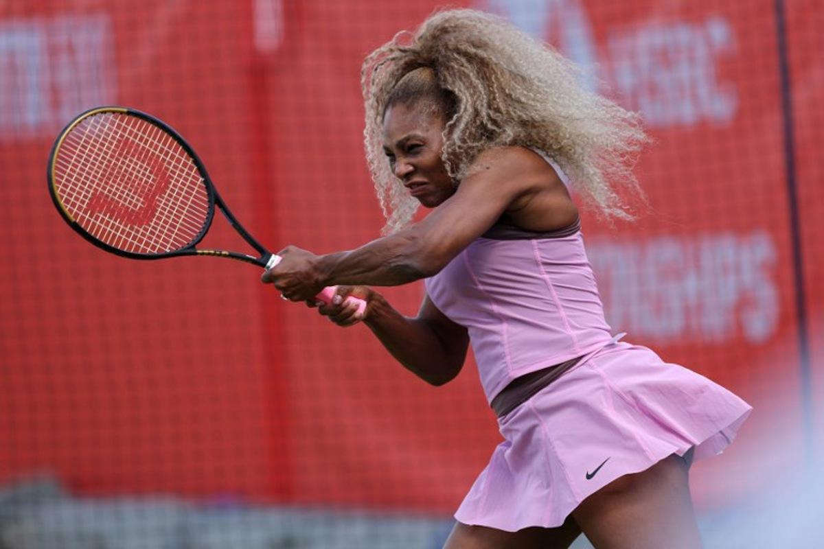 US player Serena Williams hits a shot during a practice session before her doubles match at the HSBC WTA tennis Championships at Queen's Club in west London on June 9, 2026.  Adrian Dennis / AFP