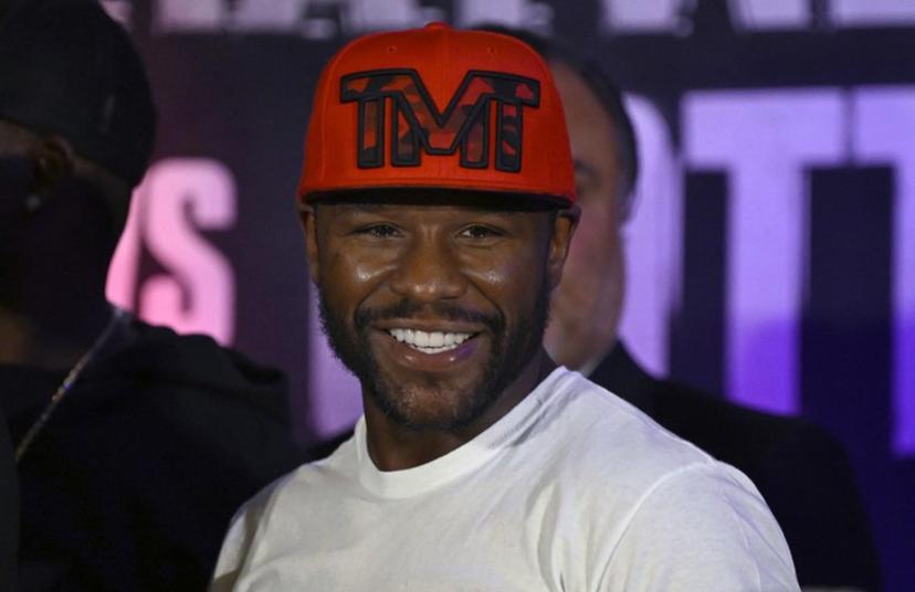 US boxer Floyd Mayweather Jr. smiles during the weighing ceremony for his upcoming exhibition fight against John Gutti III in Mexico City on August 23, 2024. Mayweather Jr. and Gotti III will face each other in an exhibition fight in Mexico on August 24, 2024. ALFREDO ESTRELLA / AFP