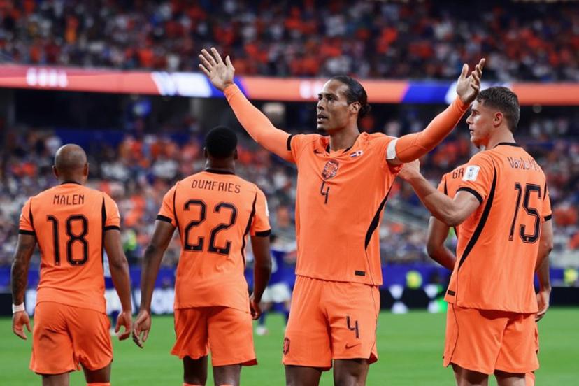 Netherlands' defender #04 Virgil van Dijk (C) celebrates  after scoring the opening goal during the 2026 World Cup Group F football match between the Netherlands and Japan at the Dallas Stadium in Arlington on June 14, 2026.   Aric Becker / AFP