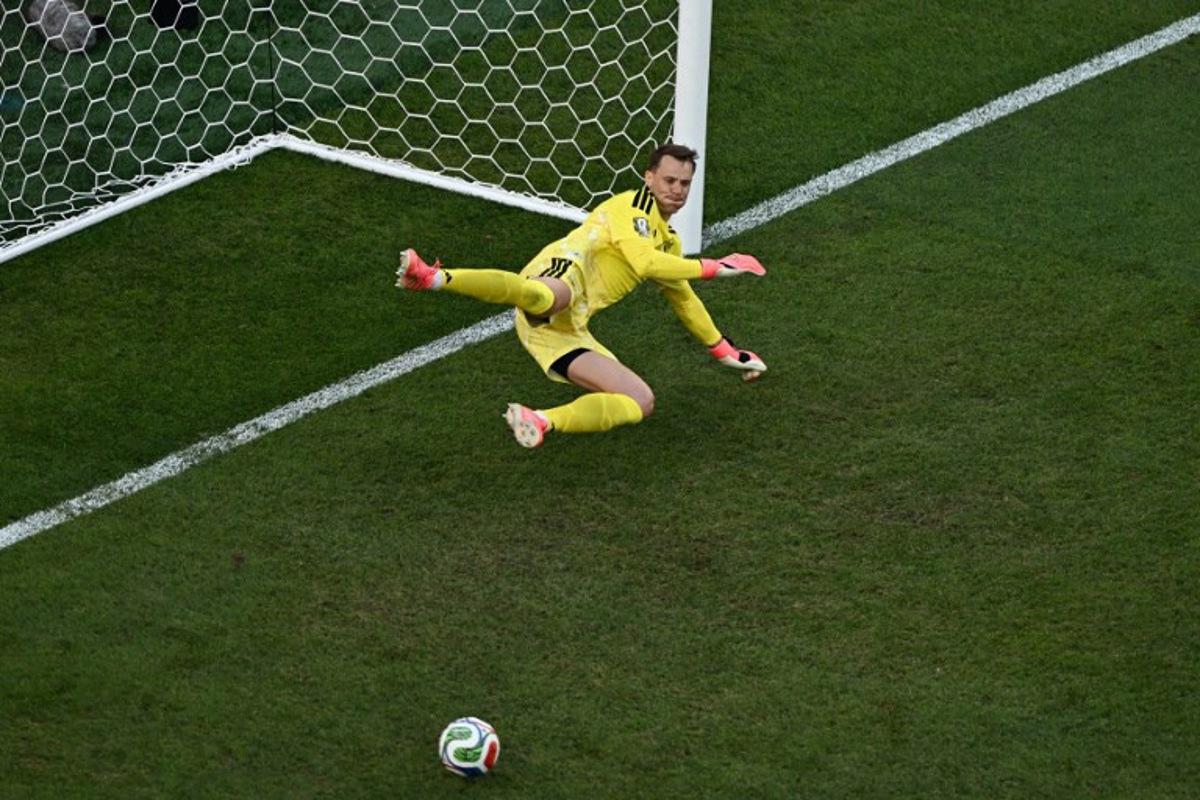 Germany's goalkeeper #01 Manuel Neuer saves a penalty kick by Paraguay's forward #09 Antonio Sanabria during the penalty shootout of the 2026 World Cup round of 32 football match between Germany and Paraguay at the Boston Stadium in Foxborough on June 29, 2026.   Jewel SAMAD / AFP