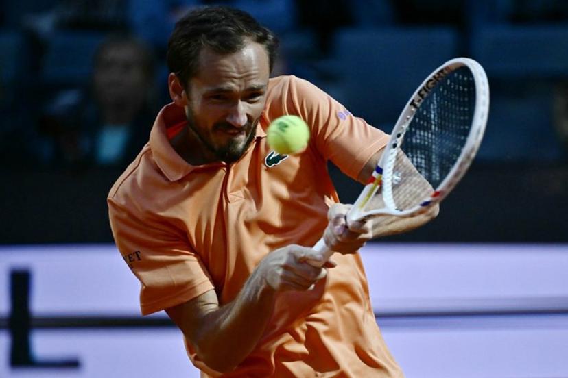 Russia's Daniil Medvedev hits a return to Spain's Martin Landaluce during the ATP Rome Open tennis tournament at Foro Italico in Rome on May 14, 2026.   Filippo MONTEFORTE / AFP