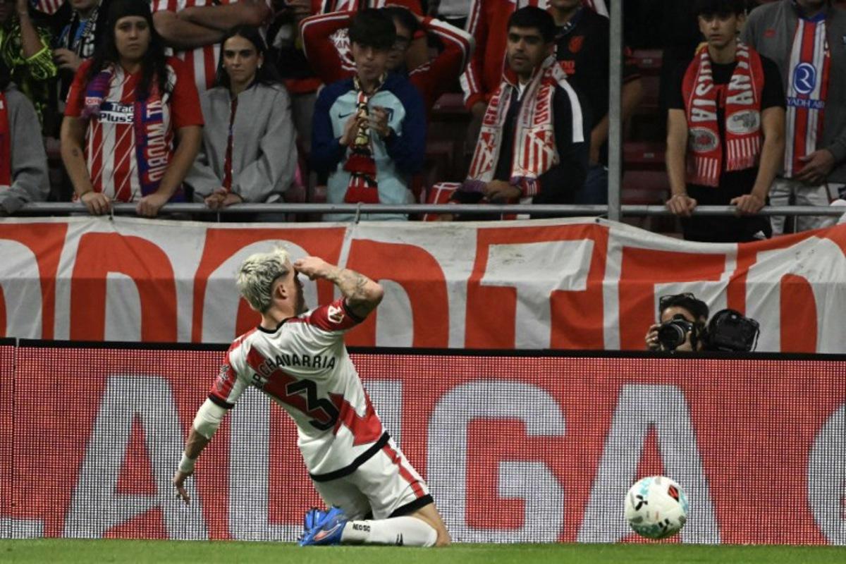 Rayo Vallecano's Spanish defender #03 Pep Chavarria celebrates scoring their first goal during the Spanish league football match between Club Atletico de Madrid and Rayo Vallecano de Madrid at the Metropolitano stadium in Madrid on September 24, 2025.  Javier SORIANO / AFP