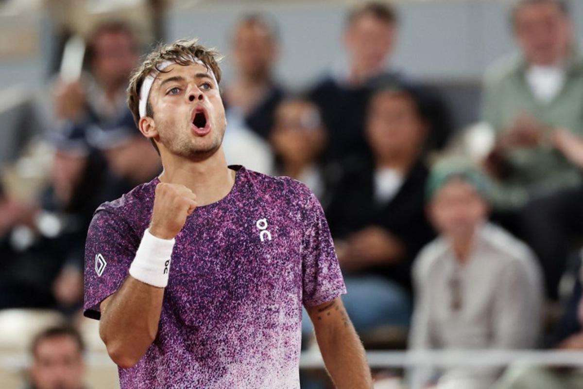 Italy's Flavio Cobolli reacts after a point as he plays against Canada's Felix Auger-Aliassime during their men's quarter final singles match on day 11 of the French Open tennis tournament on Court Philippe-Chatrier at the Roland-Garros Complex in Paris on June 3, 2026.  ALAIN JOCARD / AFP