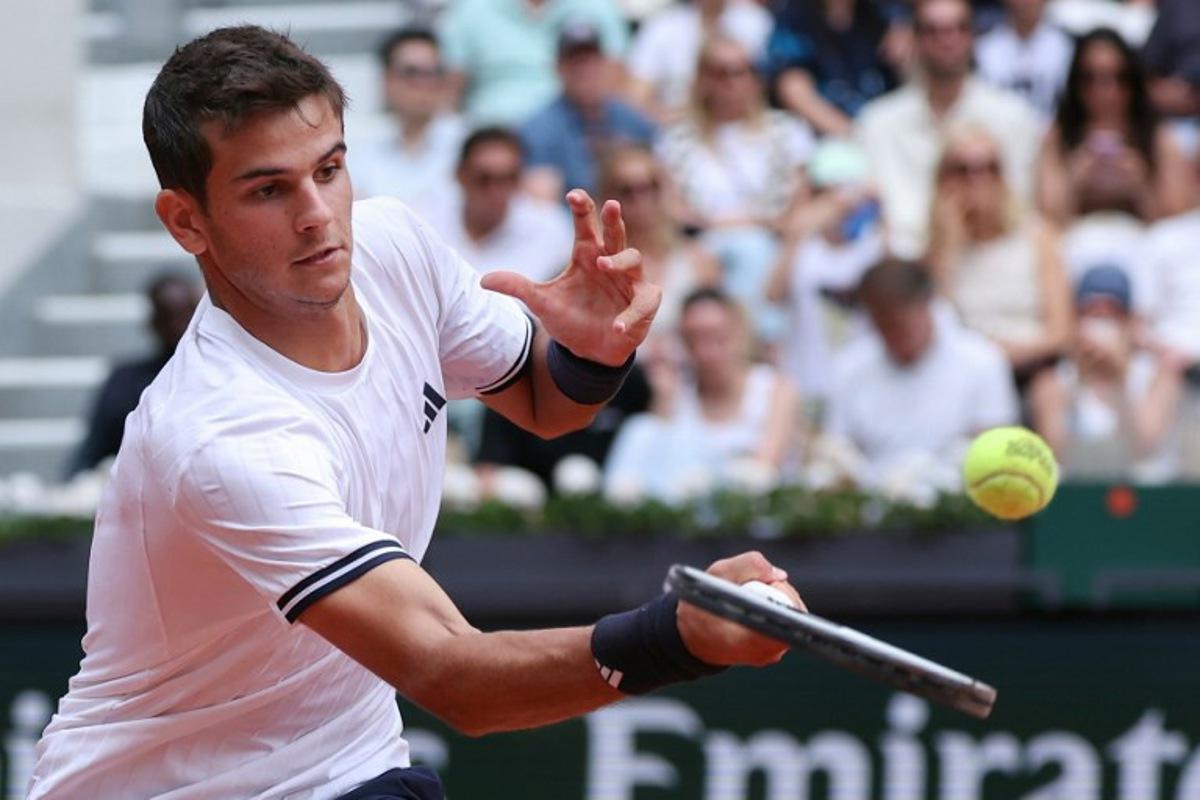 Spain's Rafael Jodar plays a forehand return to Spain's Pablo Carreno Busta during their men's singles match on day 8 of the French Open tennis tournament on Court Suzanne-Lenglen at the Roland-Garros Complex in Paris on May 31, 2026.  ALAIN JOCARD / AFP