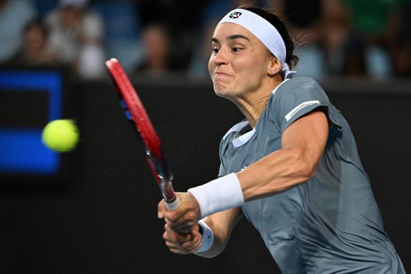 Ukraine's Anhelina Kalinina hits a shot against Tunisia's Ons Jabeur during their women's singles match on day three of the Australian Open tennis tournament in Melbourne on January 14, 2025.  Paul Crock / AFP