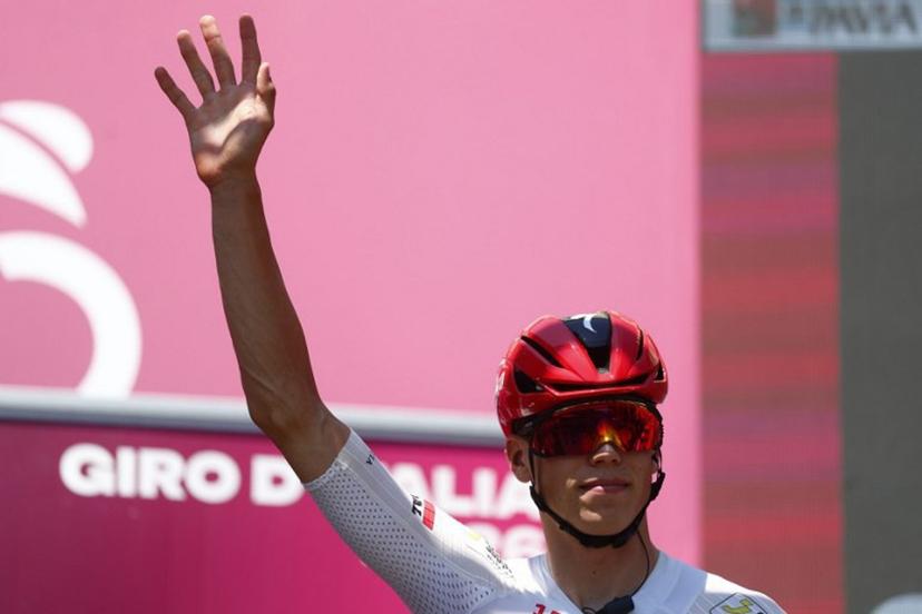 Soudal Quick-Step French rider Paul Magnier waves on stage before the 15th stage of the Giro d'Italia 2026 - Tour of Italy cycling race between Voghera and Milan, Italy, on May 24, 2026.  Luca Bettini / AFP