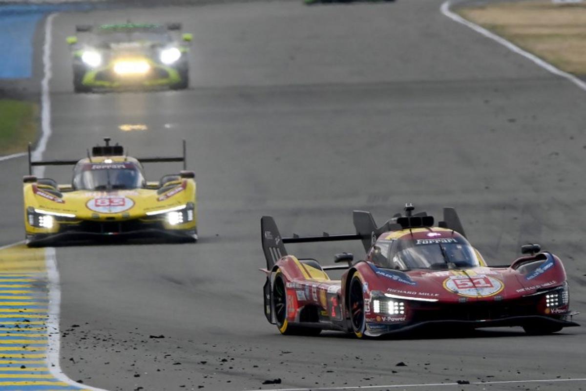 Ferrari AF Corse Thor Team's hypercar #51 Italian driver Antonio Gioninazzi (R) and Ferrari AF Corse Thor Team's hypercar #83 Polish driver Robert Kubica compete in the 24 Hours of Le Mans 2025, at the Le Mans circuit, north-western France, on June 15, 2025.   JEAN-FRANCOIS MONIER / AFP