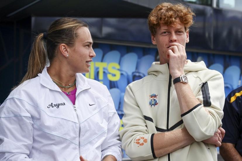 Current Australian Open tennis champions Aryna Sabalenka (L) of Belarus and Italy's Jannik Sinner talk as they wait to participate in an offical ceremony for the main draw, ahead of the Australian Open tennis tournament in Melbourne on January 9, 2025.  DAVID GRAY / AFP