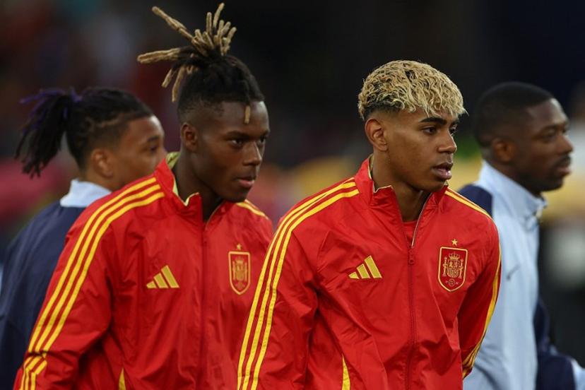 Spain's forward #19 Lamine Yamal (R) and Spain's forward #11 Nico Williams (L) walk on to the pitch prior to the UEFA Nations League semi-final football match between Spain and France in Stuttgart, southwestern Germany, on June 5, 2025.  FRANCK FIFE / AFP