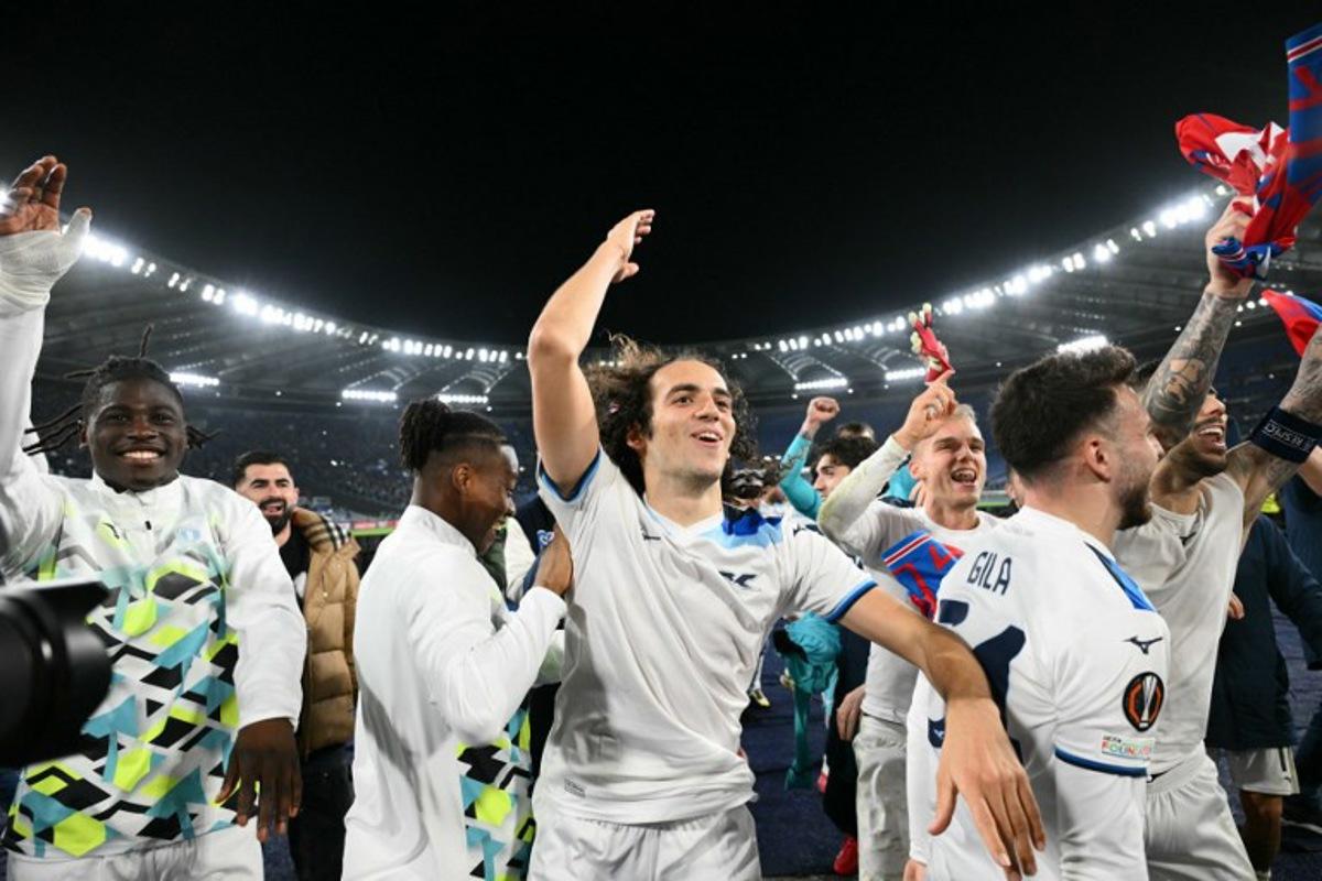 From left : Lazio's French forward #20 Loum Tchaouna, Lazio's French midfielder #08 Matteo Guendouzi, and Lazio's Spanish defender #34 Mario Gila Fuentes celebrate at the end of the EUFA Europa League last 16 second leg football match between Lazio and Viktoria Plzen at the Olympic stadium in Rome, on March 13, 2025. Match ended on 1-1 draw and Lazio qualified for quarter finals.  Alberto PIZZOLI / AFP