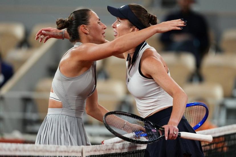 Ukraine's Marta Kostyuk (L) and Ukraine's Elina Svitolina (R) embrace at the end of their women's quarter final singles match on day 10 of the French Open tennis tournament on Court Philippe-Chatrier at the Roland-Garros Complex in Paris on June 2, 2026.  Dimitar DILKOFF / AFP