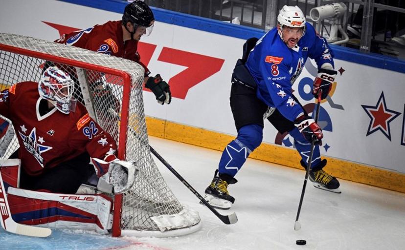 NHL's Russian Alexander Ovechkin (R) attacks the net of KHL's Daniil Isayev during the charity hockey "Match of the Year" between Russian players of the National Hockey League (NHL) and the Kontinental Hockey League (KHL) at the CSKA arena in Moscow on July 13, 2025.  Alexander NEMENOV / AFP
