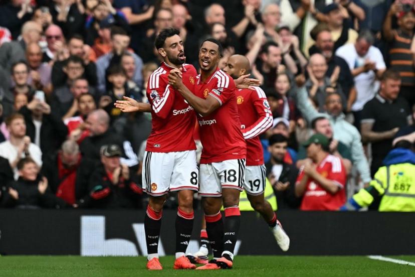 Manchester United's Portuguese midfielder #08 Bruno Fernandes (L) celebrates after scoring the team's first goal during the English Premier League football match between Manchester United and Ipswich Town at Old Trafford in Manchester, north west England, on August 30, 2026.  Paul ELLIS / AFP