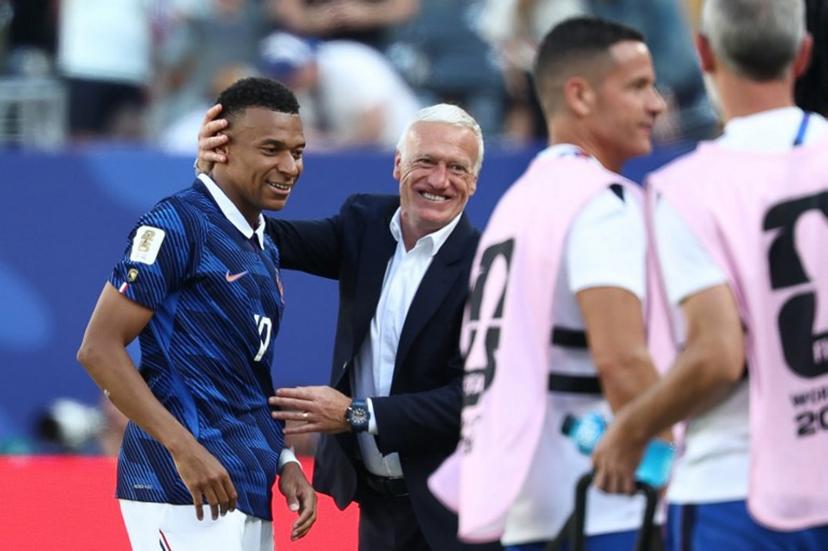 France's head coach Didier Deschamps congratulates his forward #10 Kylian Mbappe after scoring his team's first goal during the 2026 World Cup Group I football match between France and Senegal at the New York/New Jersey Stadium in East Rutherford on June 16, 2026.   FRANCK FIFE / AFP