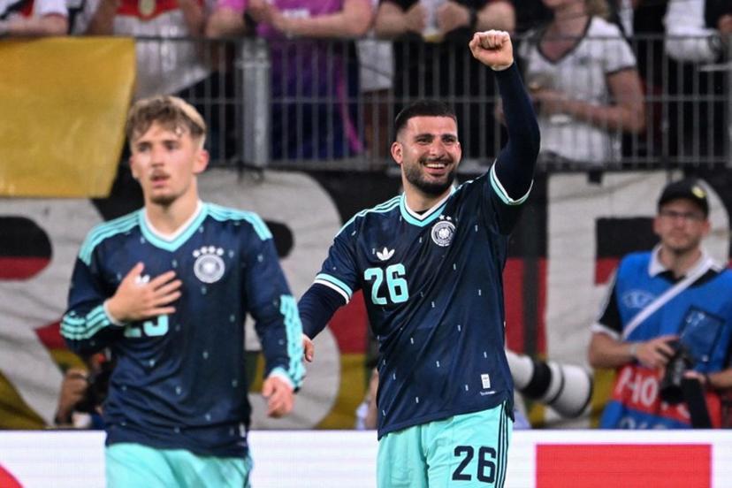 Germany's forward #26 Deniz Undav (R) celebrates scoring his team's first goal with Germany's midfielder #25 Lennart Karl during a friendly match between Germany and Finland ahead of the 2026 FIFA World Cup football tournament, in Mainz, western Germany on May 31, 2026.  Kirill KUDRYAVTSEV / AFP