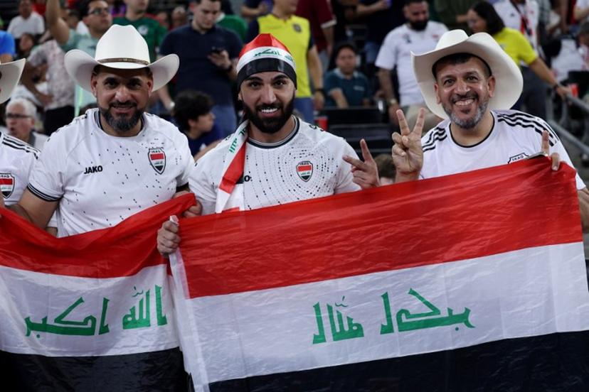 Iraqi fans celebrate after winning the 2026 FIFA World Cup qualifiers final playoff football match between Iraq and Bolivia at the BBVA Stadium in Guadalupe, Nuevo Leon state, Mexico, on March 31, 2026.  Julio Cesar AGUILAR / AFP