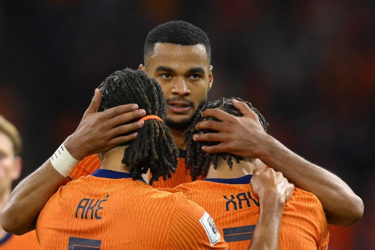 Netherlands' forward #11 Cody Gakpo (C) celebrates with teammates after scoring his team's fourth goalduring the FIFA World Cup 2026 Group G qualification football match between Netherlands and Finland, at the Johan Cruyff Arena in Amsterdam, on October 12, 2025.  JOHN THYS / AFP