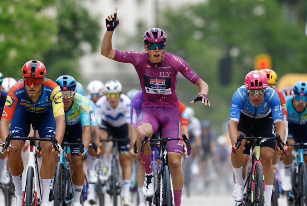 Soudal Quick-Step French rider Paul Magnier wearing the points classification mauve jersey (Maglia Ciclamino) celebrates as he crosses the finish line to win the 3nd stage of the Giro d'Italia 2026 - Tour of Italy cycling race between Plovdiv and Sofia, Bulgaria, on May 10, 2026.  Luca Bettini / AFP