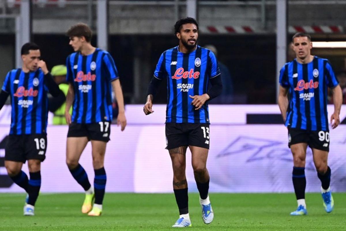 Atalanta's Brazilian midfielder #13 Ederson (C) reacts after scoring his team's first goal during the Italian Serie A football match between AC Milan and Atalanta Bergamo at San Siro Stadium in Milan on May 10, 2026.  Piero CRUCIATTI / AFP