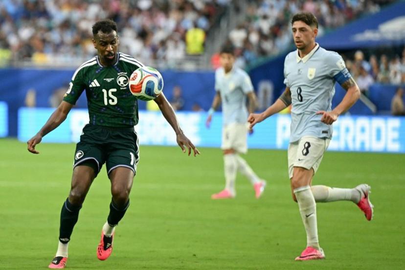 Saudi Arabia's midfielder #15 Abdullah Al-Khaibari and Uruguay's midfielder #08 Federico Valverde fight for the ball during the 2026 World Cup Group H football match between Saudi Arabia and Uruguay at the Miami Stadium in Miami Gardens on June 15, 2026.   CHANDAN KHANNA / AFP