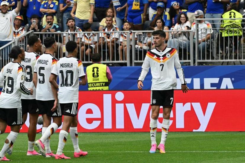 Germany's forward #07 Kai Havertz (R) celebrates with teammates after scoring a penalty kick for his team's third goal during the 2026 World Cup Group E football match between Germany and Curacao at the Houston Stadium in Houston on June 14, 2026.   RONALDO SCHEMIDT / AFP