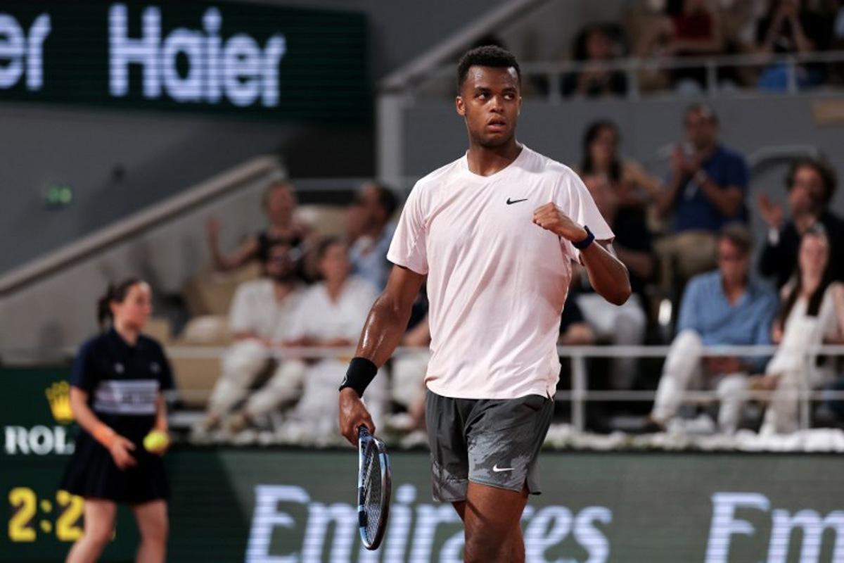 France's Giovanni Mpetshi Perricard reacts after a point as he plays against Serbia's Novak Djokovic during their men's singles match on day 1 of the French Open tennis tournament on Court Philippe-Chatrier at the Roland-Garros Complex in Paris on May 24, 2026.  Thomas SAMSON / AFP