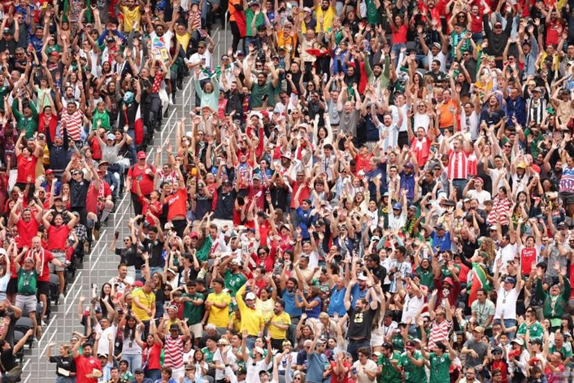 Canadian fans cheer for their team during the 2026 World Cup round of 32 football match between South Africa and Canada at the Los Angeles Stadium in Inglewood on June 28, 2026.   ETIENNE LAURENT / AFP