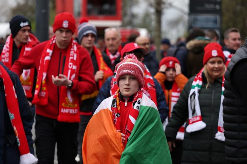 Liverpool fans arrive for the UEFA Champions League quarter final, second-leg football match between Liverpool and Paris Saint-Germain at Anfield in Liverpool, north west England on April 14, 2026.  FRANCK FIFE / AFP